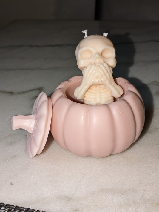 Skeleton in a pumpkin candle